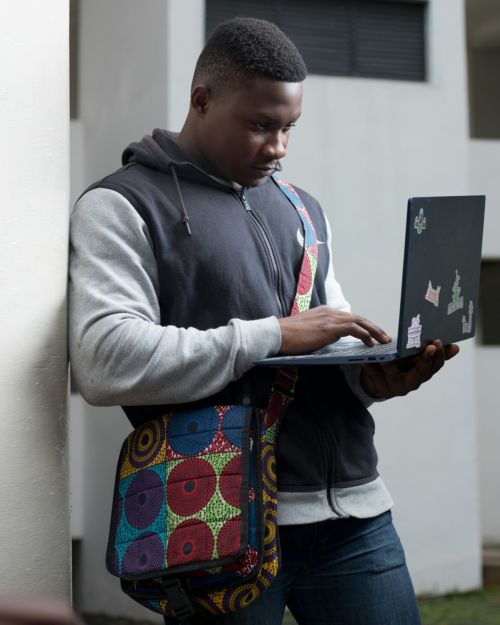 A young African student using a laptop